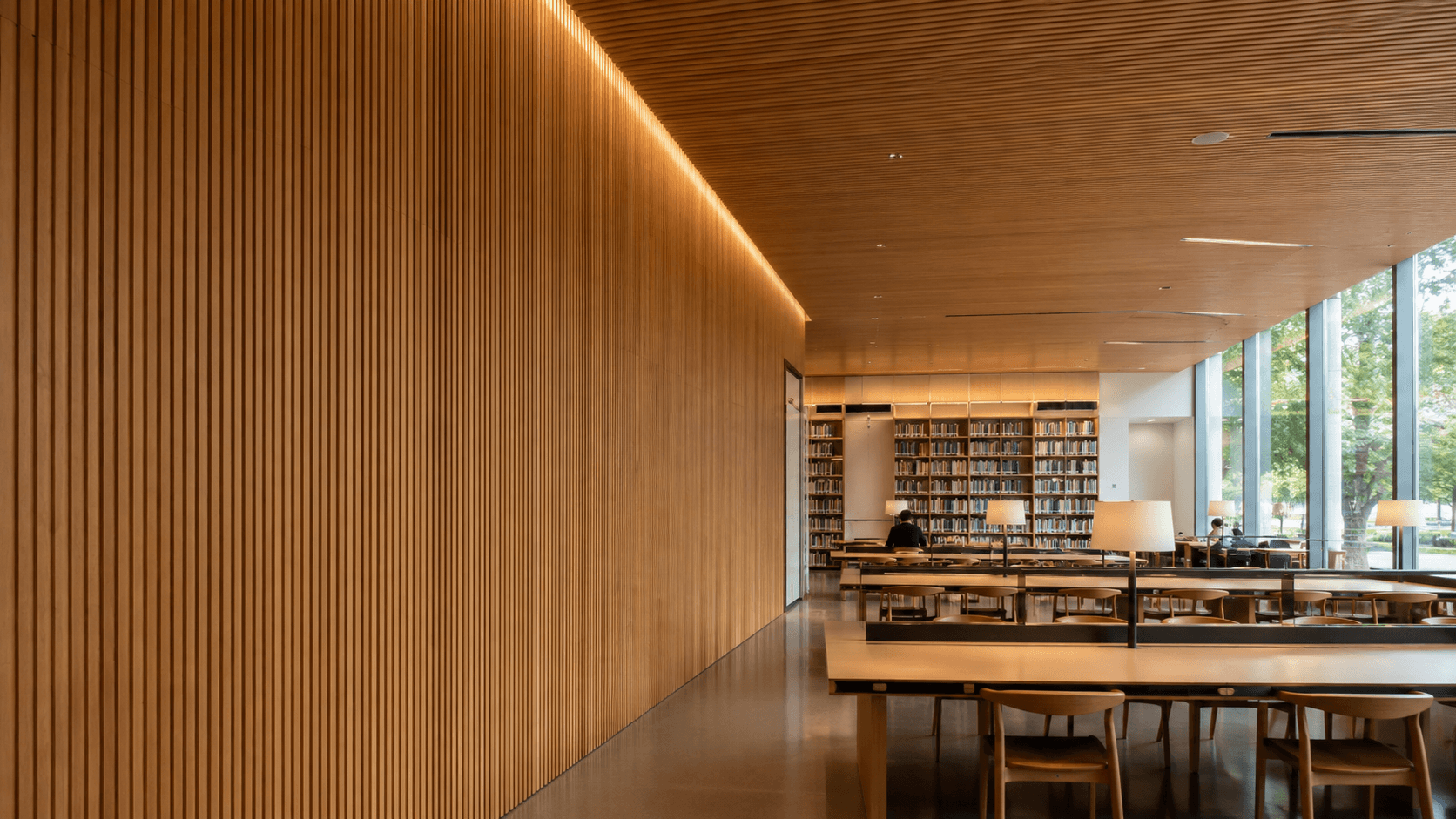 Bamboo wood fiber acoustic panel wall in a modern reading space